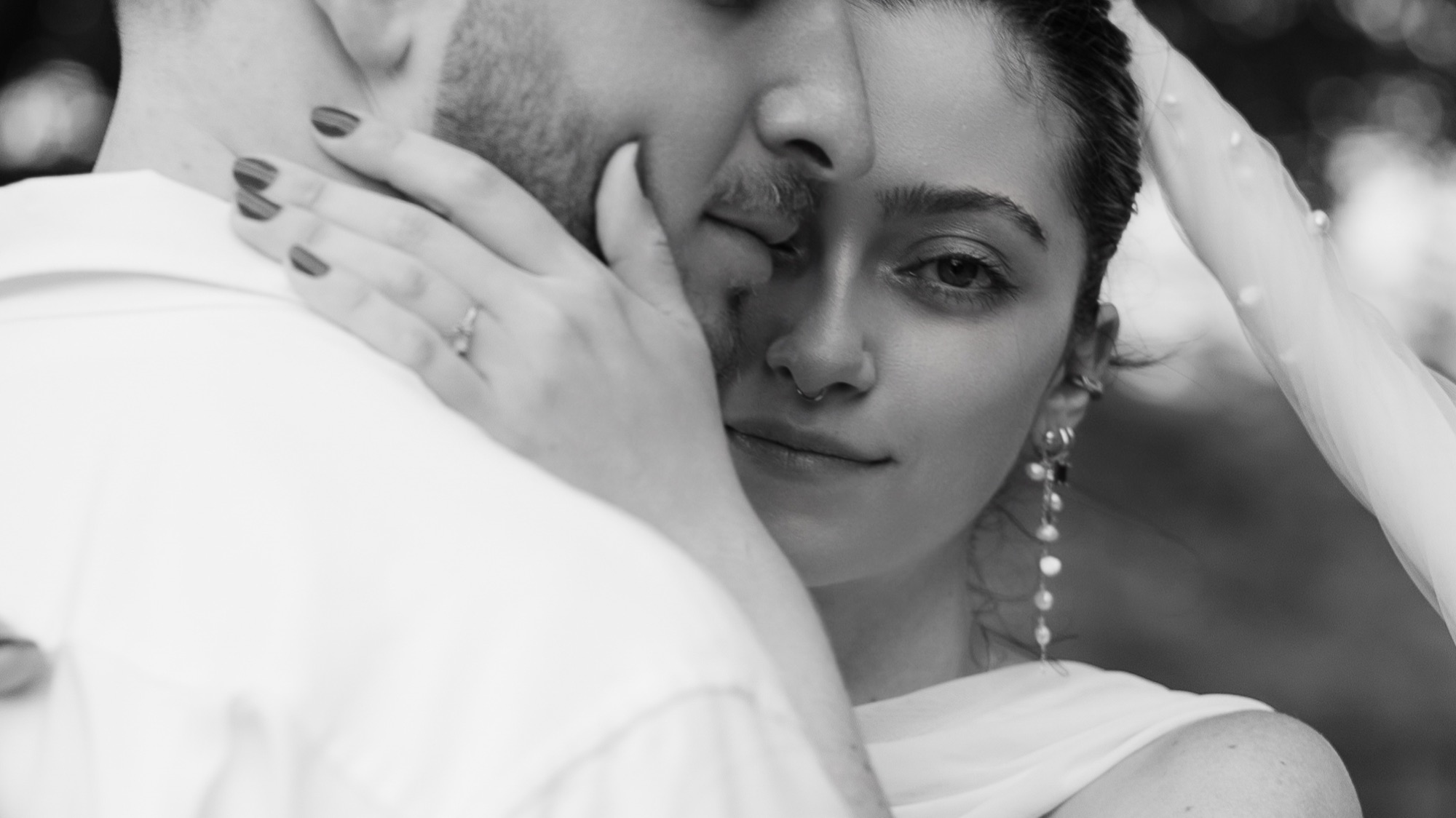 Black and white pre-wedding portrait, bride and groom, intimate closeup