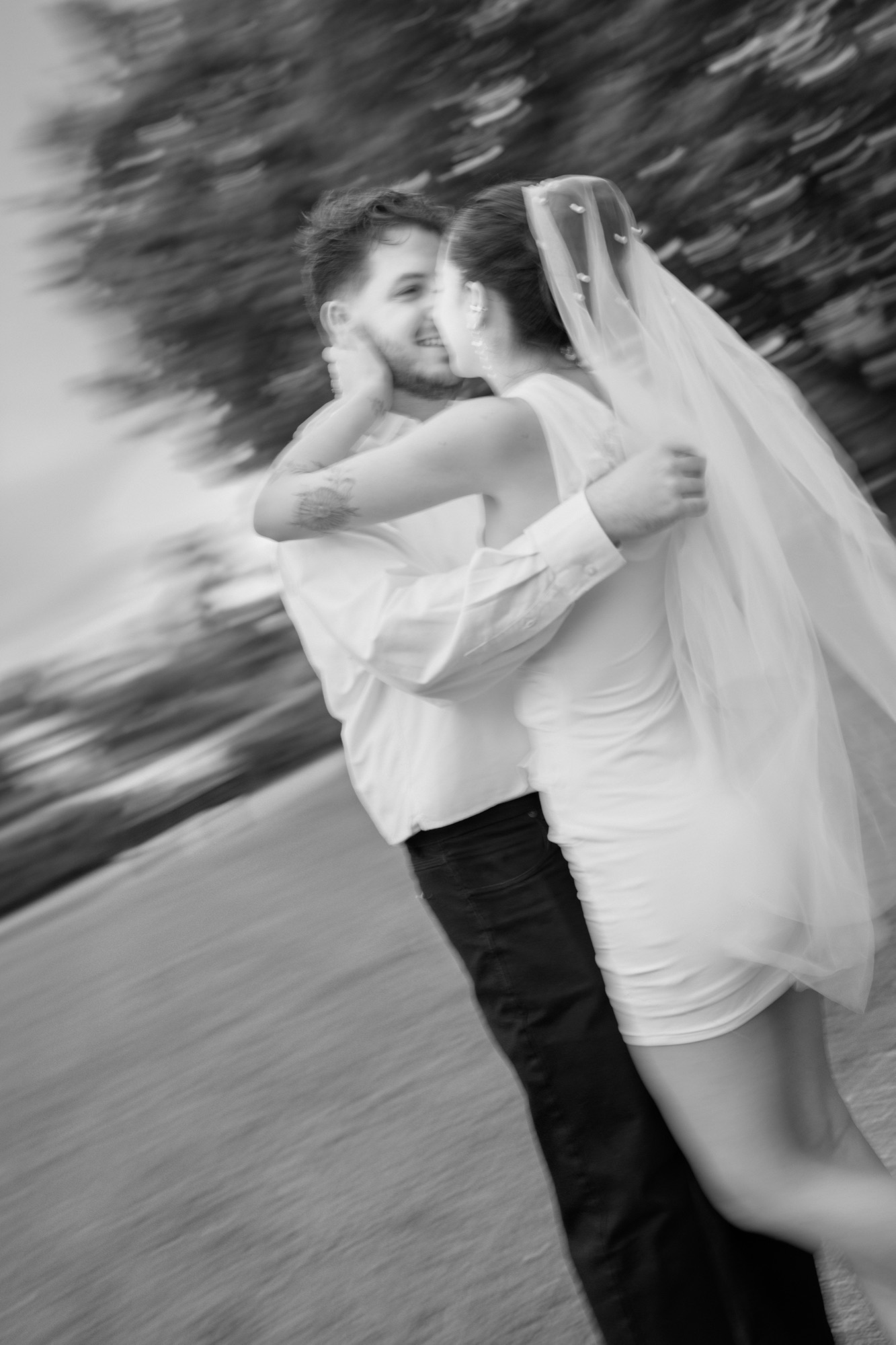 Motion blur, veil in wind, couple embrace